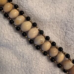 Elegant Beaded Necklace with Cream and Black Accents